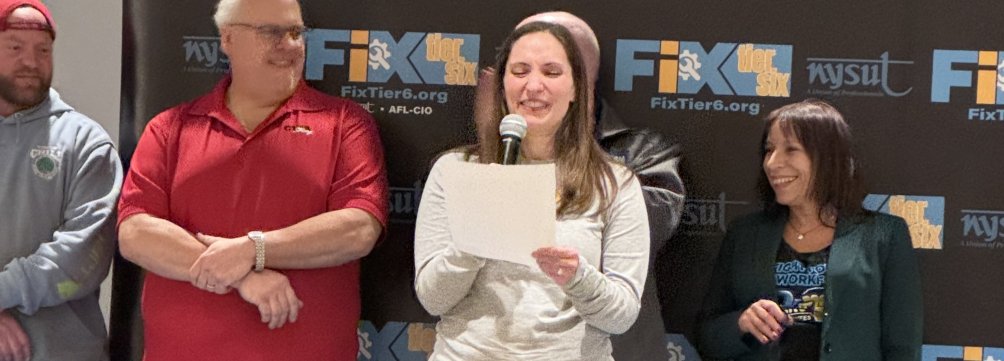 Katie Cole speaking at the Fix Tier Six rally