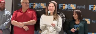 Katie Cole speaking at the Fix Tier Six rally